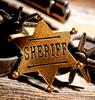 значок шерифа